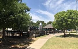 Wooden playground surrounded by trees at Regional Park