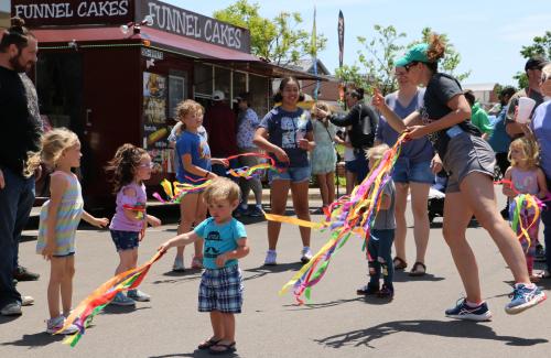 Children dancing with streamers
