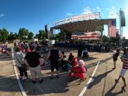 Crowd seated around stage