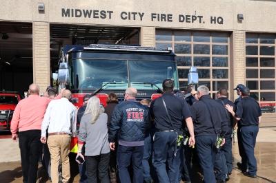 Firefighters and City leaders push the new Engine 4 into MWCFD Headquarters